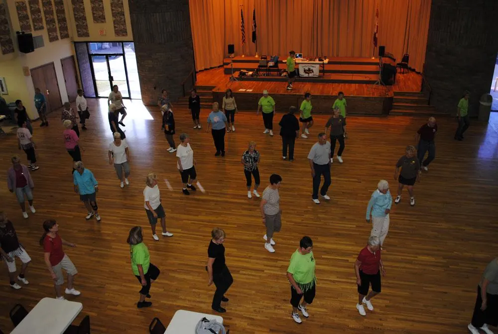 Residents line dancing in the ballroom at Sun Vista RV Resort